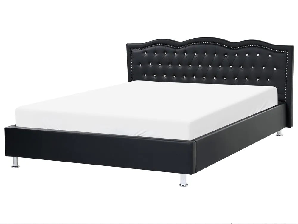 Black bed frame with tufted design on a white background