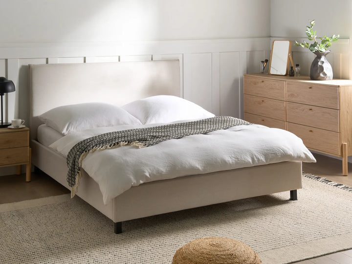 Modern upholstered bed with soft linen finish