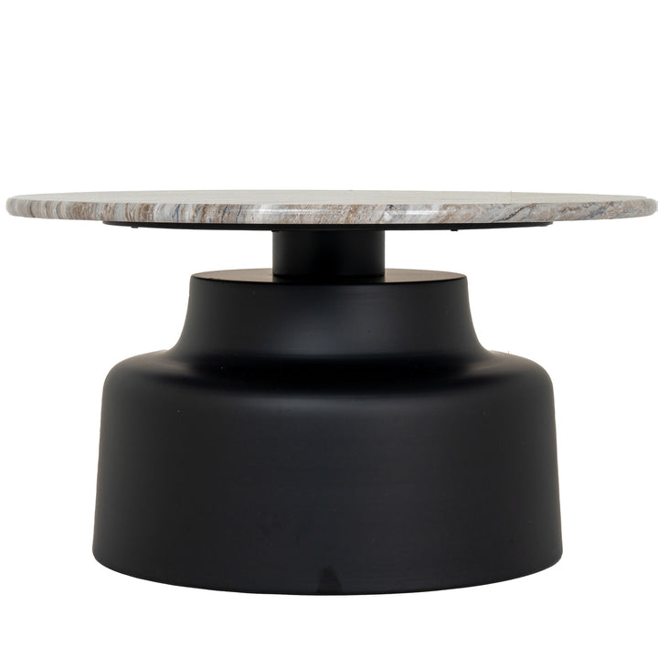 Round coffee table with marble top and black base on a white background