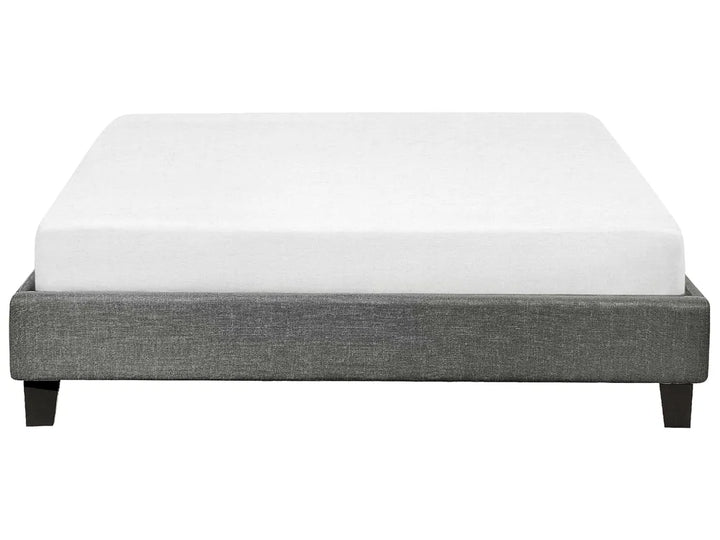 Gray bed frame with a white mattress on a white background
