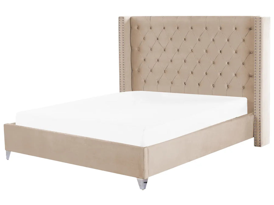 Beige upholstered bed with tufted headboard on a white background