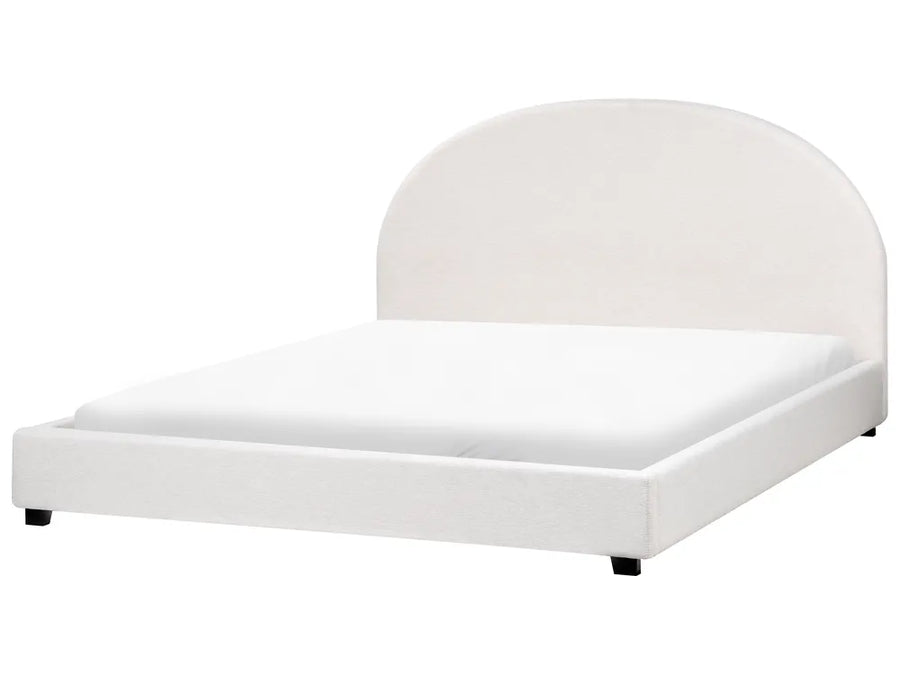 White bed with curved headboard on a white background