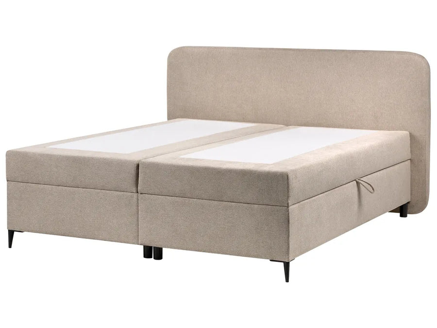 Beige upholstered bed with white mattress on a white background