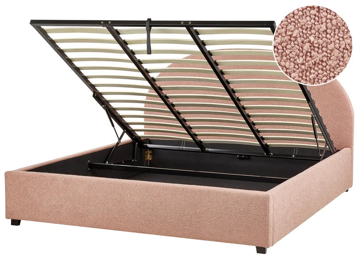 Beige upholstered bed with metal slat support on a white background