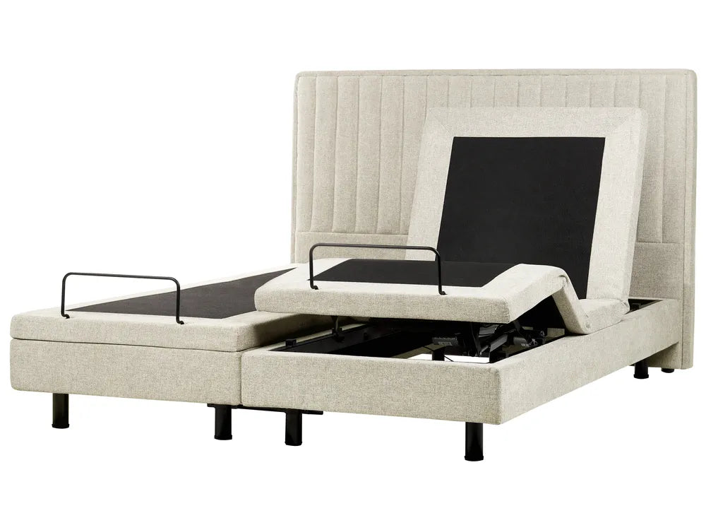 Beige adjustable bed with electric controls on a white background