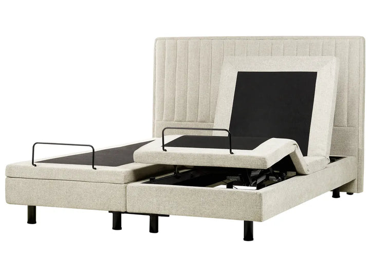 Beige adjustable bed with electric controls on a white background