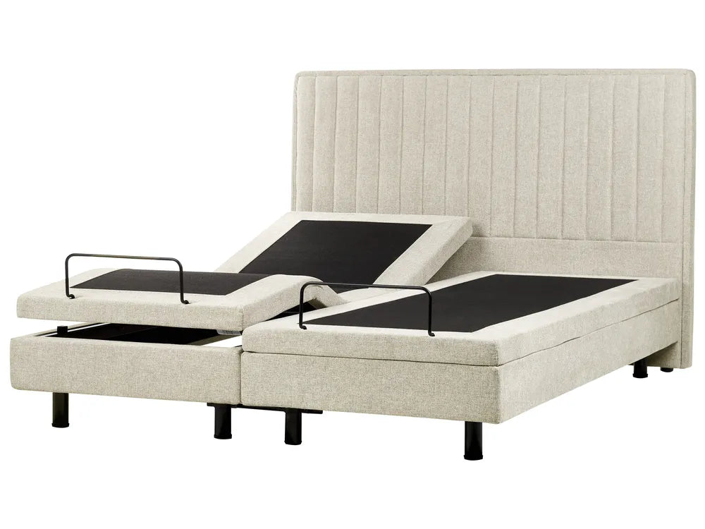 Beige adjustable bed with black control panels on a white background