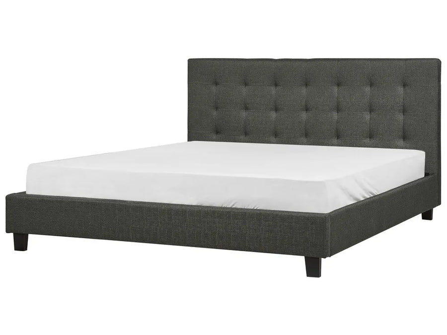 Gray upholstered bed with white mattress on a white background