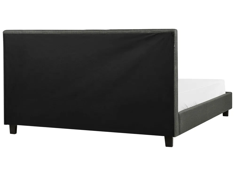 Black bed frame with white mattress on a white background