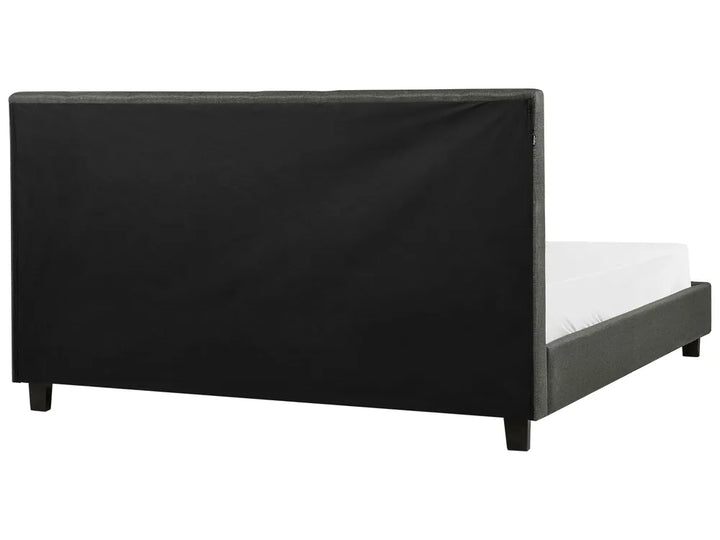 Black bed frame with white mattress on a white background