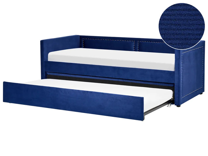 Blue upholstered bed with white mattress on a white background