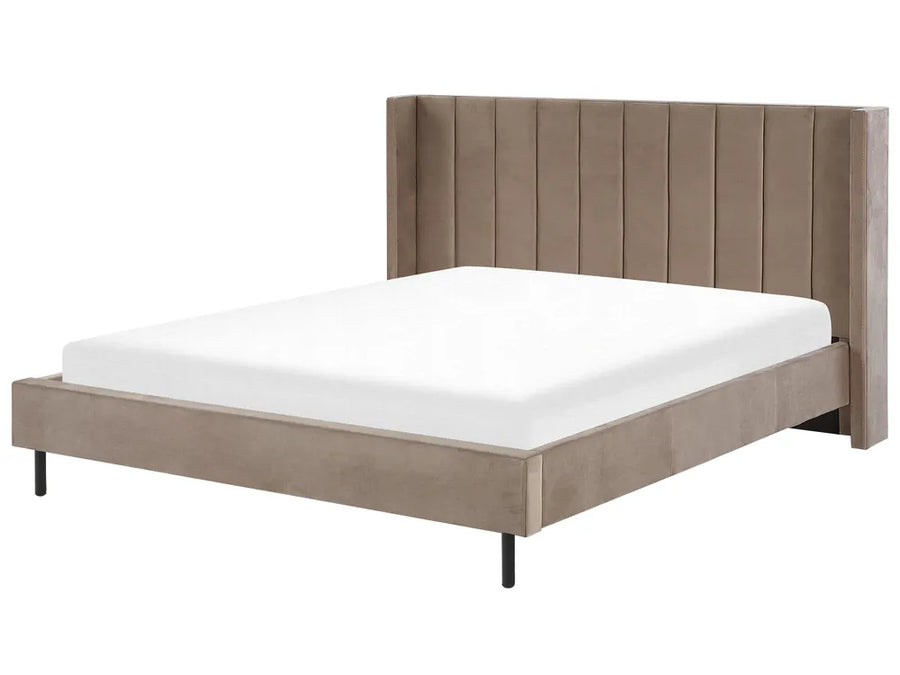 Beige upholstered bed with white mattress on a white background
