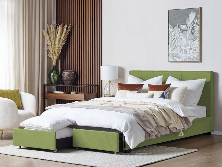 Green bed with white bedding in a bedroom setting