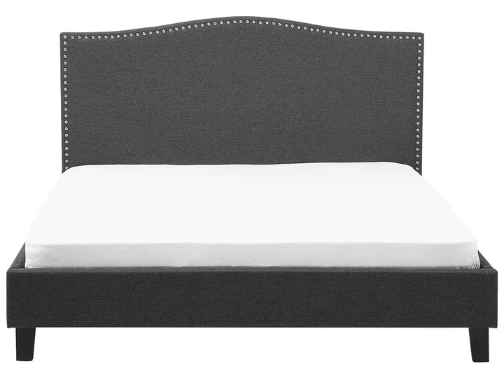 Gray upholstered bed frame with white mattress on a white background