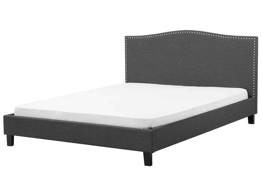 Gray upholstered bed with white mattress on a white background