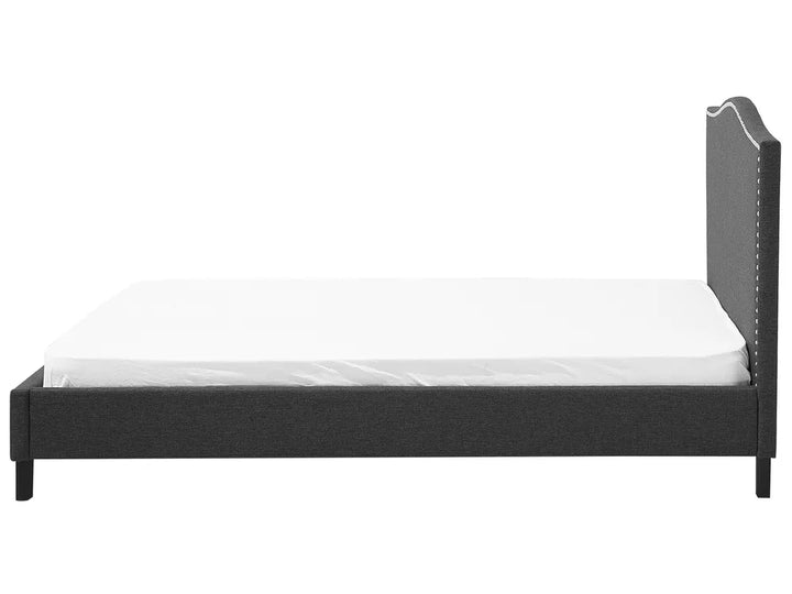 Black bed frame with white mattress on a white background