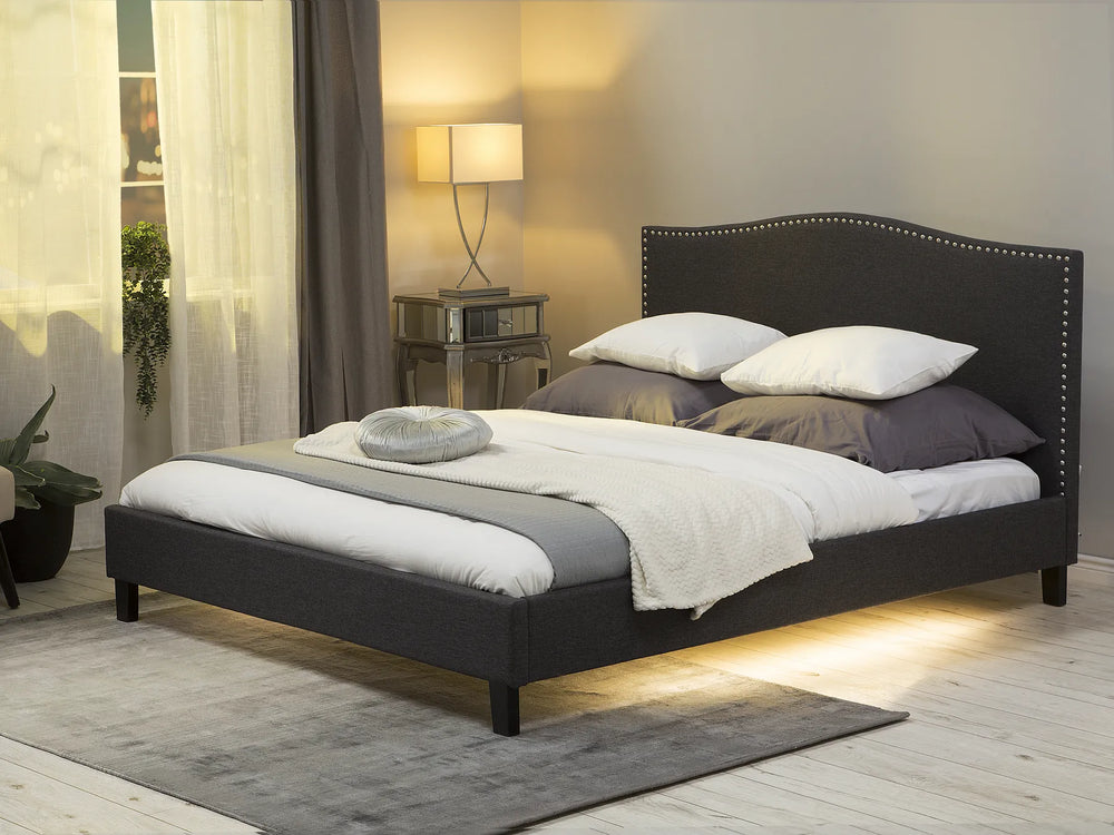 Upholstered bed with camelback headboard and LED panel