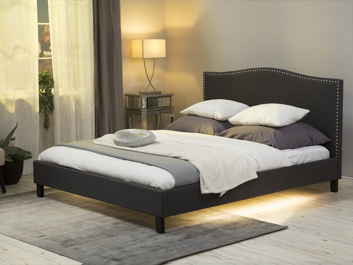 Upholstered bed with camelback headboard and LED panel