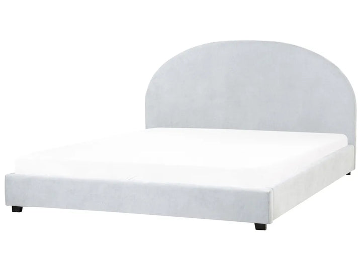 White upholstered bed frame on a white background