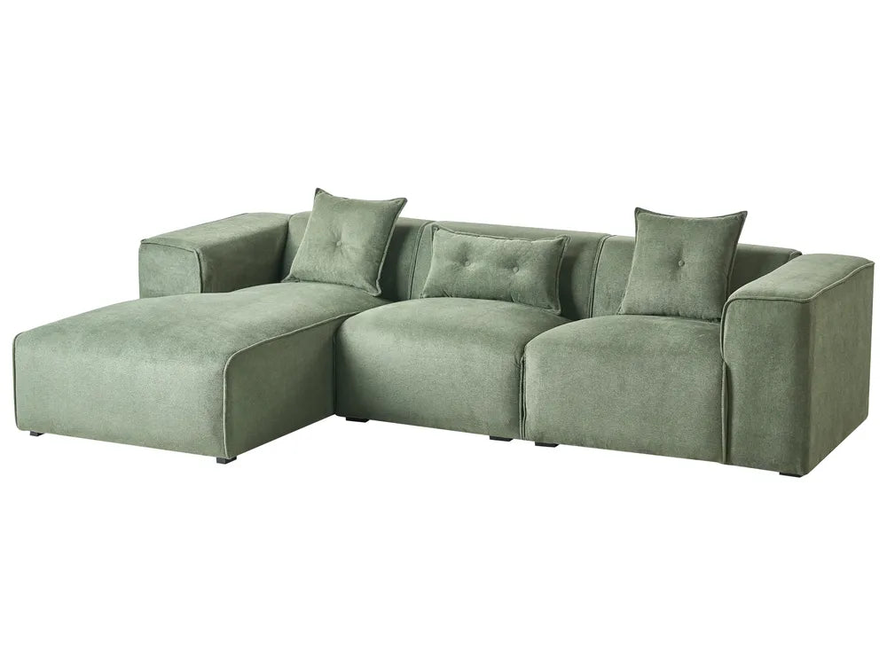 Green sectional sofa on a white background