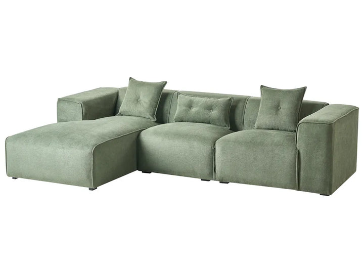 Green sectional sofa on a white background