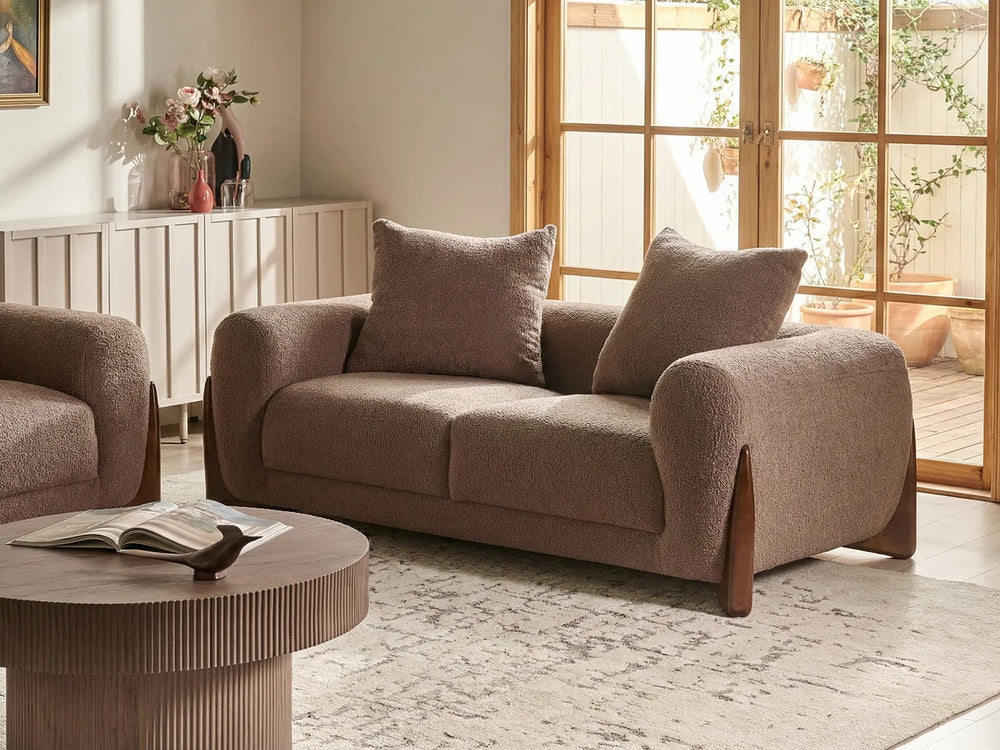 Modern brown bouclé two seater sofa with soft textured upholstery