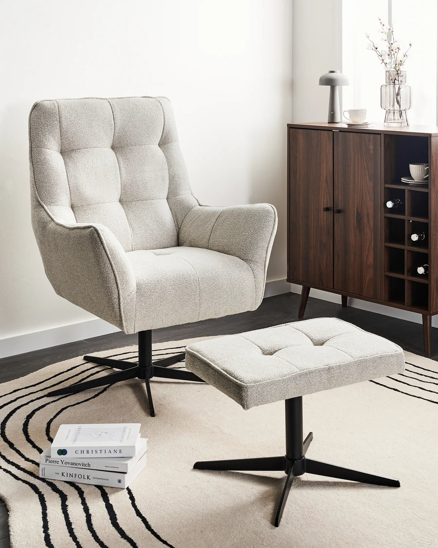 Gray armchair with ottoman in a living room setting