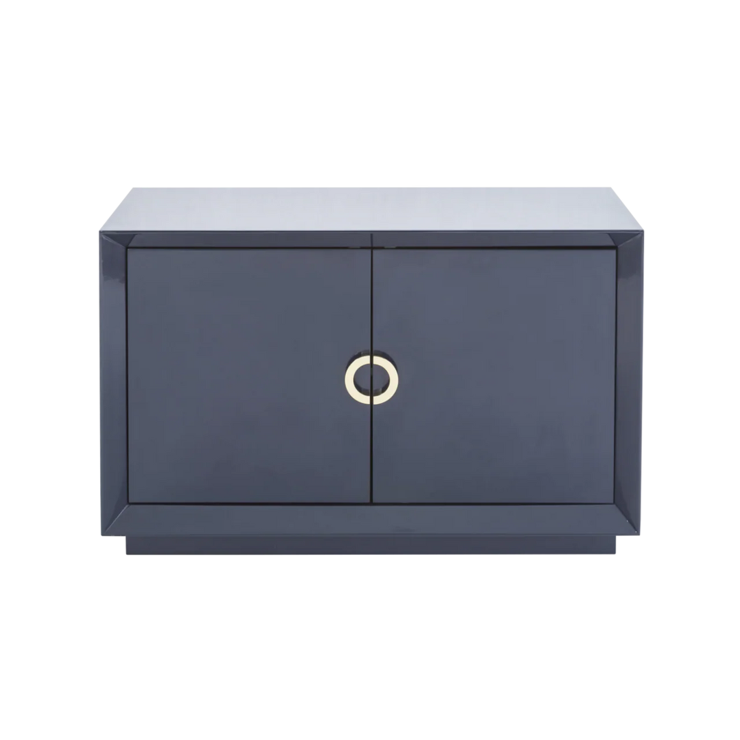 Modern dark gray cabinet with a gold circular handle on a white background