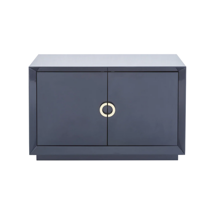 Modern dark gray cabinet with a gold circular handle on a white background