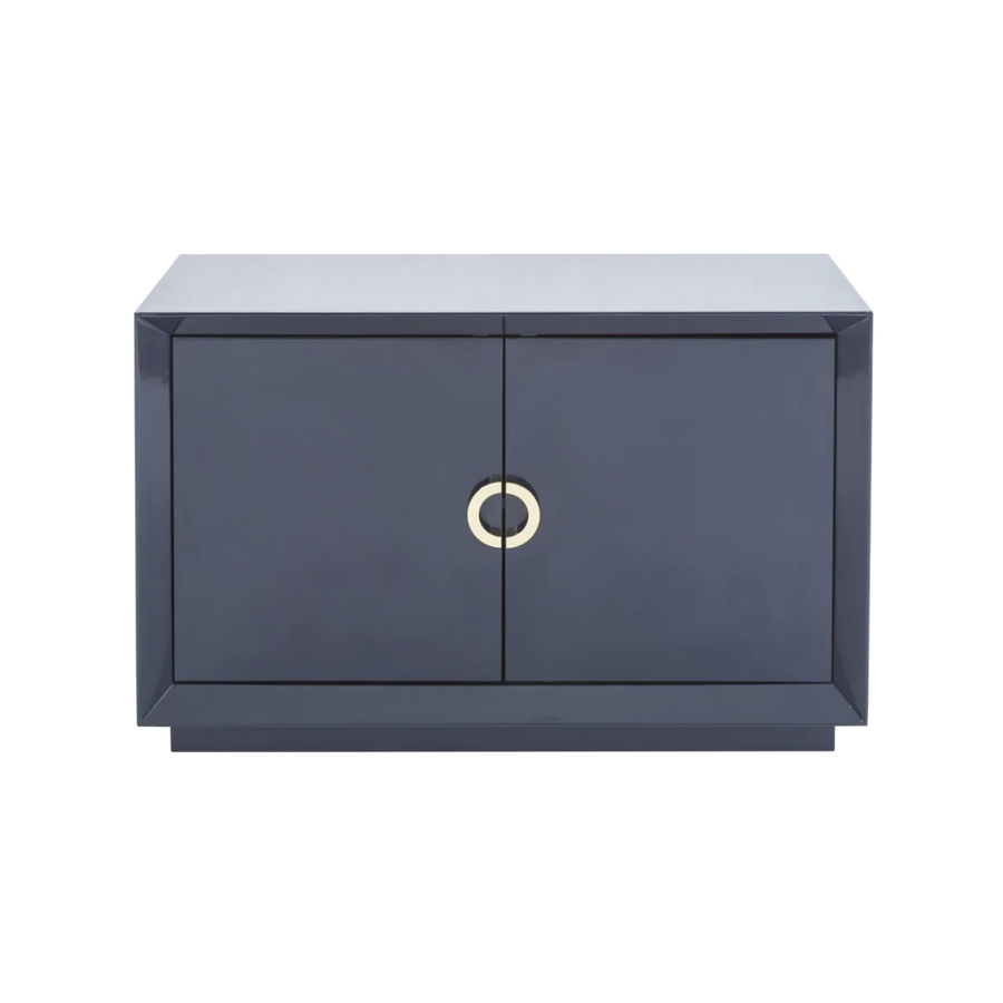 Modern dark gray cabinet with a gold circular handle on a white background