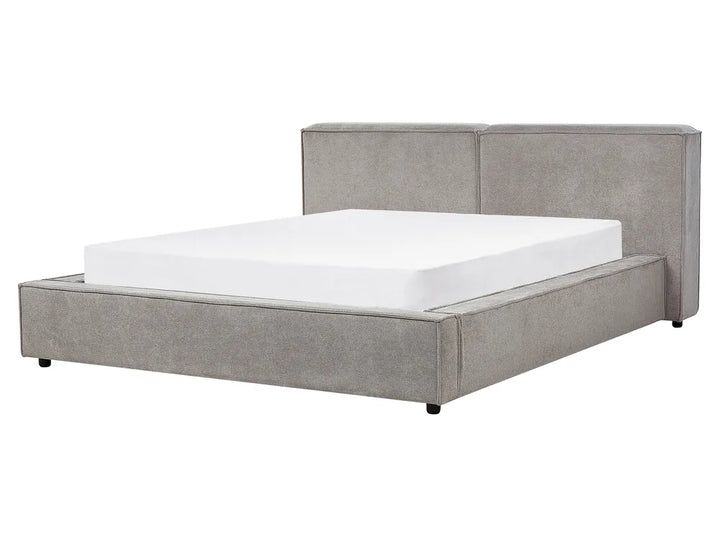 Gray upholstered bed with white mattress on a white background