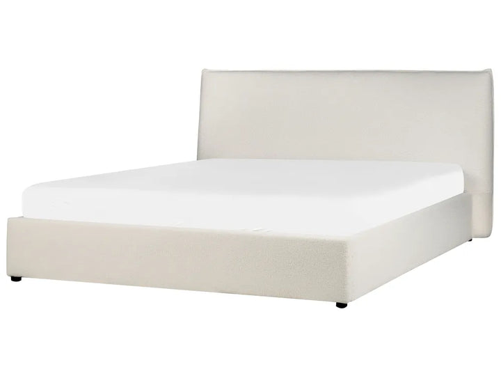 White bed with beige headboard on a white background