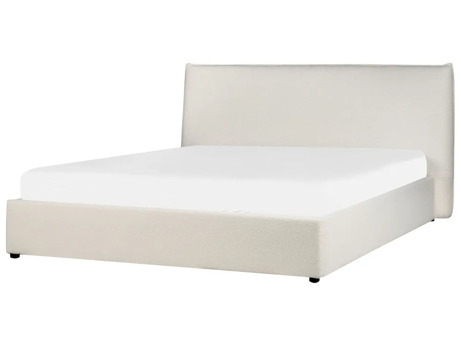 White bed with beige headboard on a white background