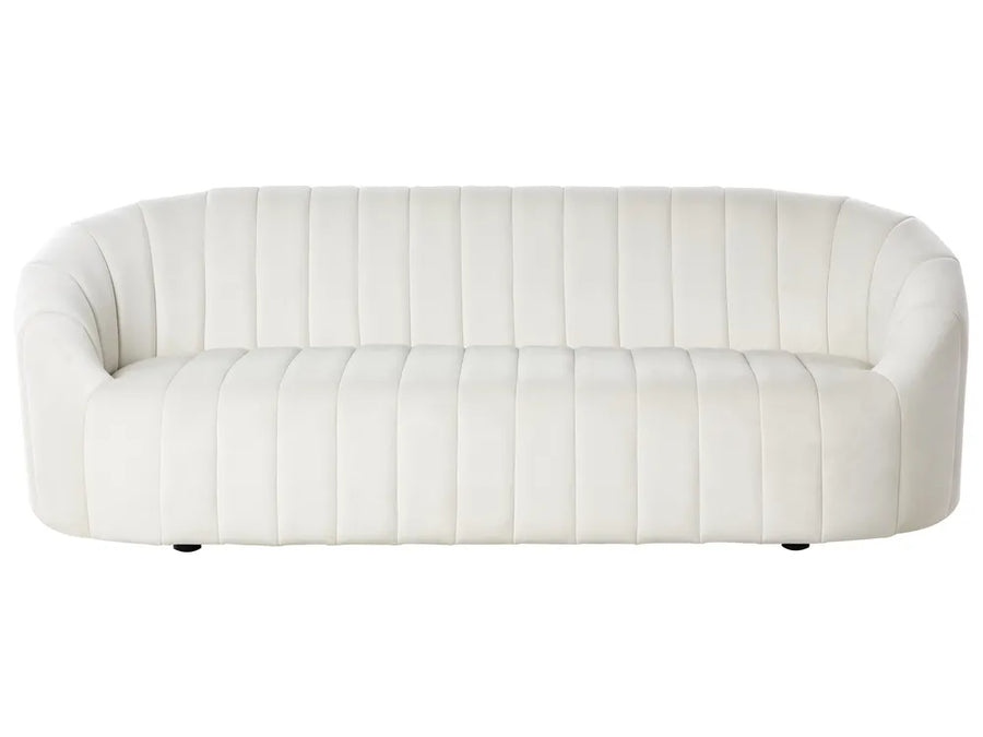White sofa with quilted design on a white background