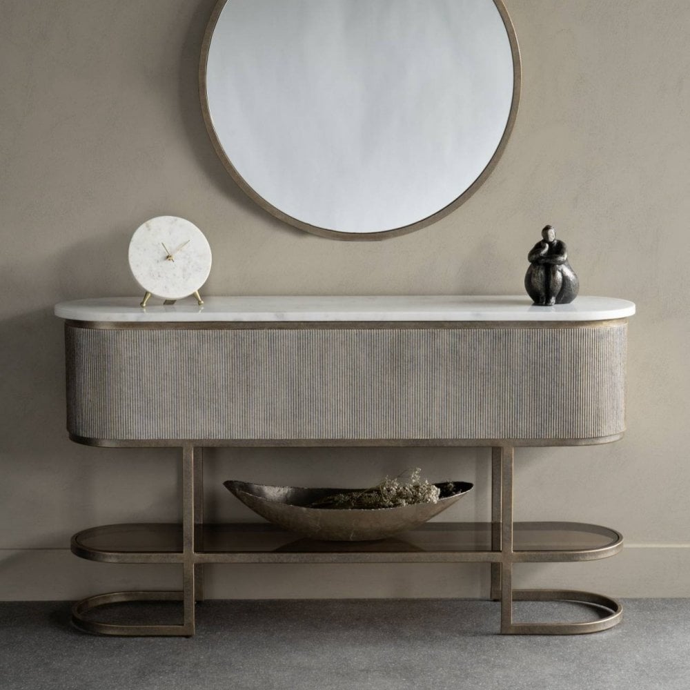 Modern console table with decorative items against a neutral wall