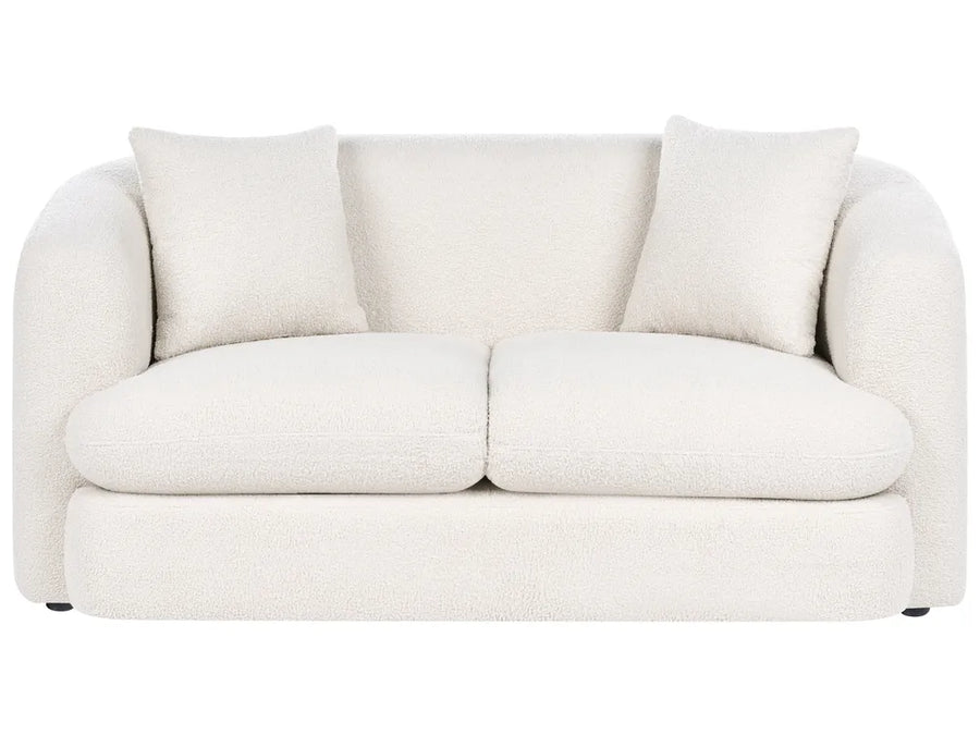 White sofa with three cushions on a white background