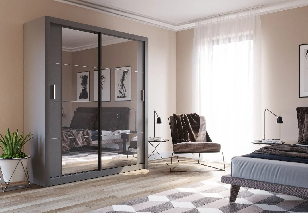 Modern bedroom with a large gray wardrobe, bed, and chair.