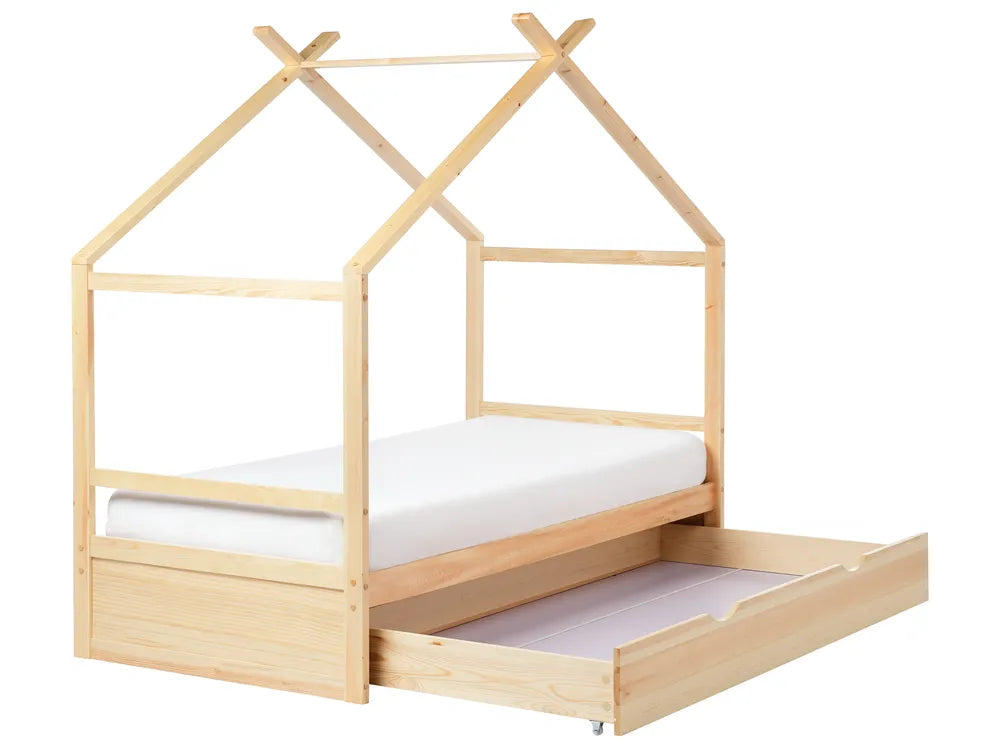 Wooden children's bed with a house design and white mattress on a white background