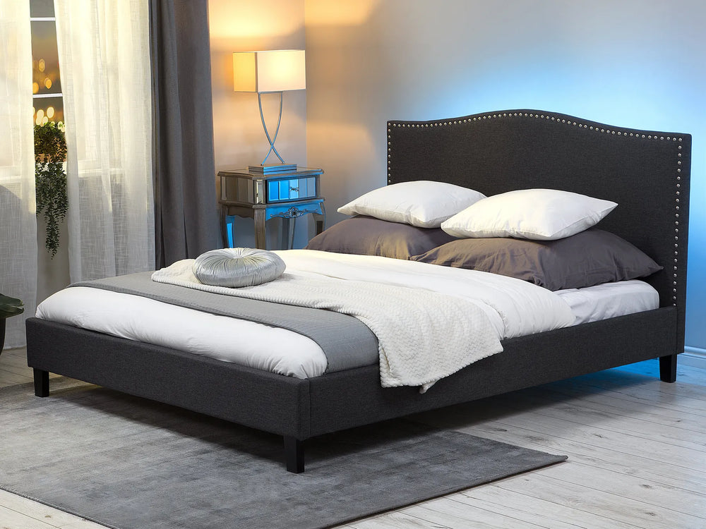Upholstered bed with camelback headboard and LED lights