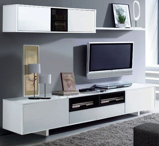 Modern living room with white entertainment console, TV, and decor items.