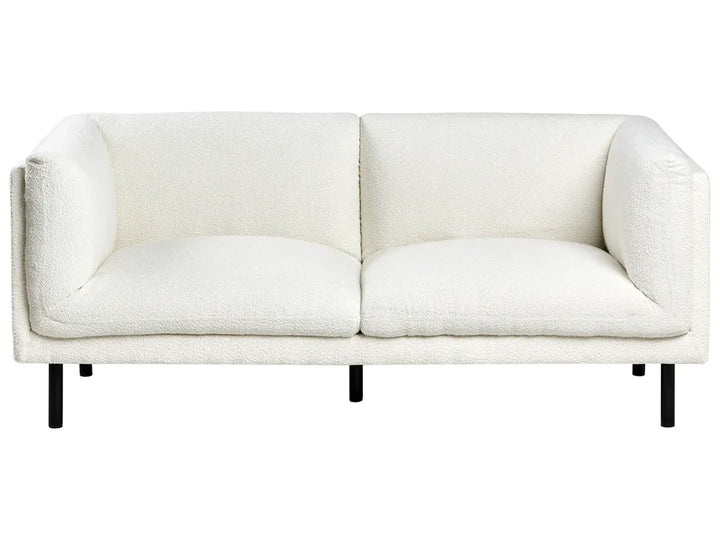 White sofa with black legs on a white background