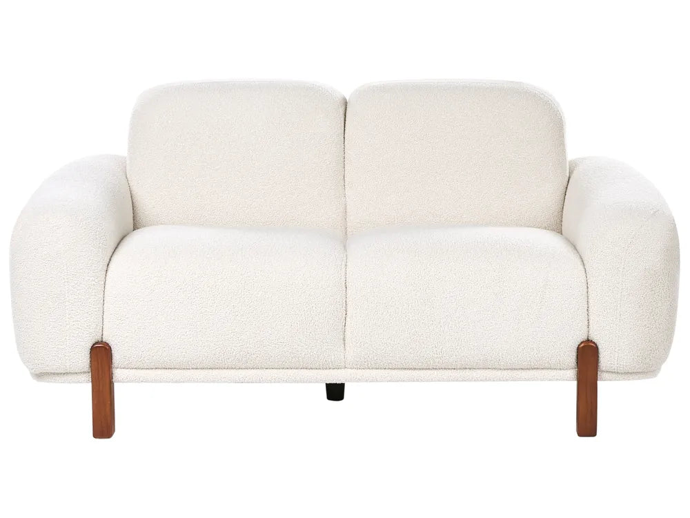 White sofa with wooden armrests on a white background