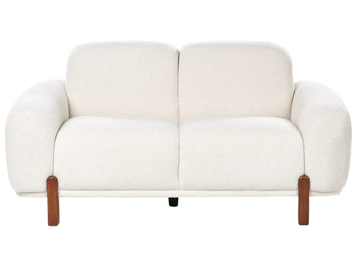 White sofa with wooden armrests on a white background