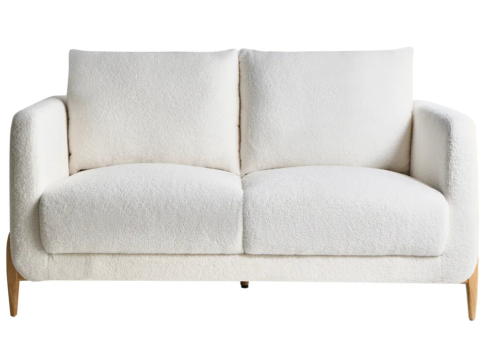 White sofa with wooden legs on a white background
