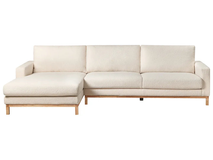 Beige sectional sofa on a white background