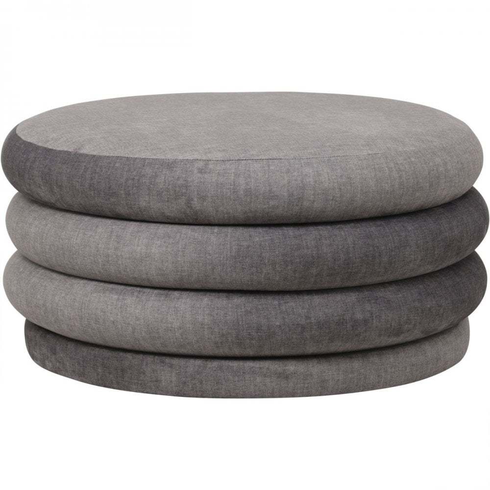 Stack of gray fabric ottomans on a white background