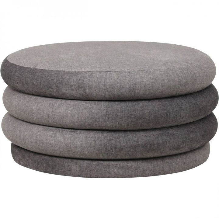 Stack of gray fabric ottomans on a white background