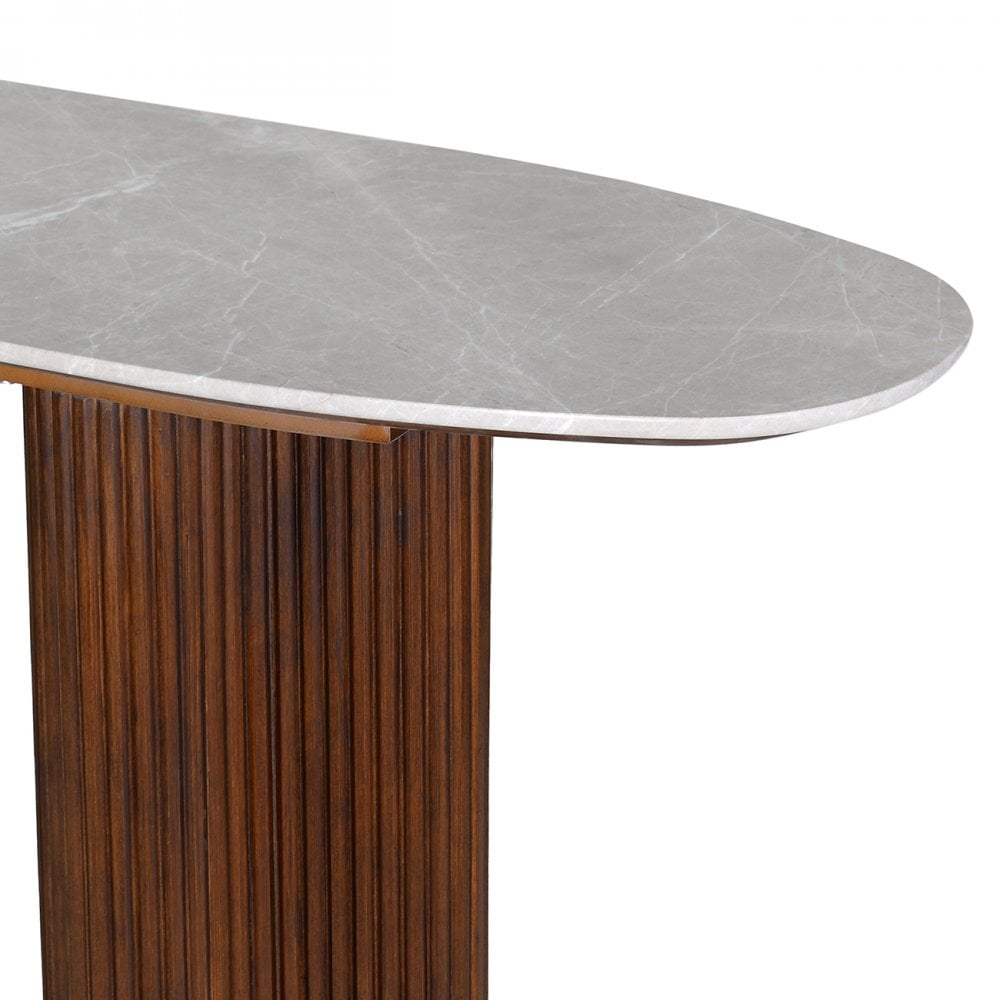 Dining table with marble-like top and wooden base on a white background