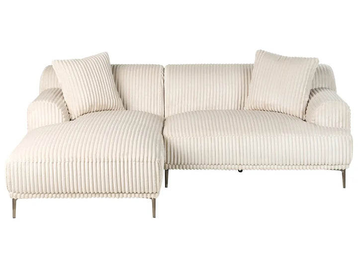 Beige ribbed sofa with cushions on a white background
