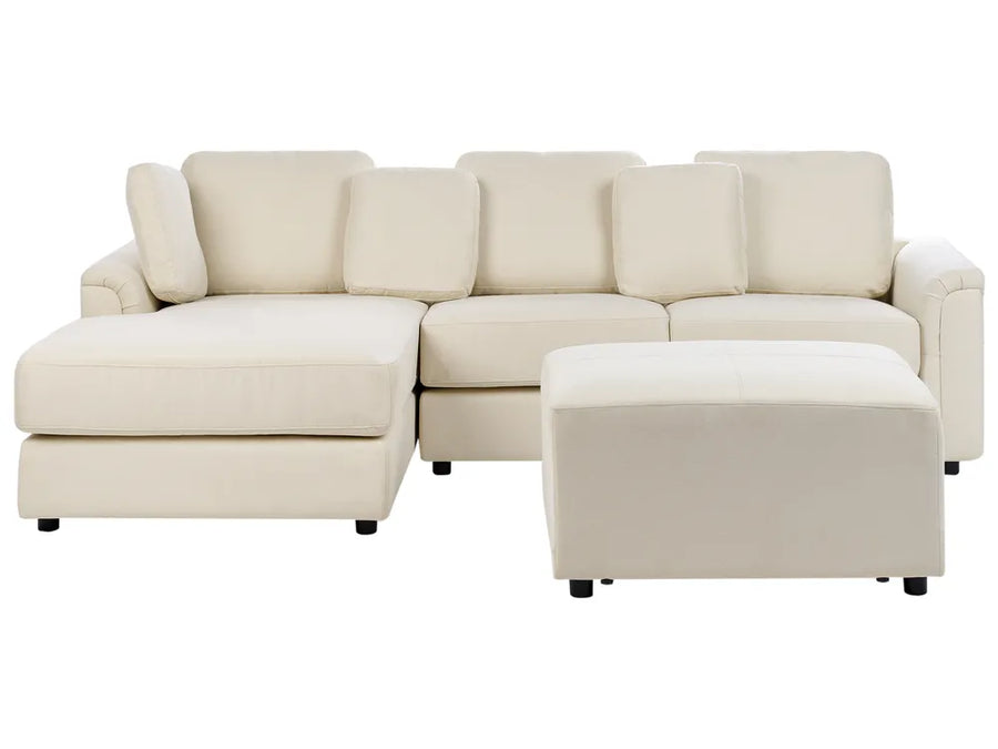 Beige sectional sofa with ottoman on a white background